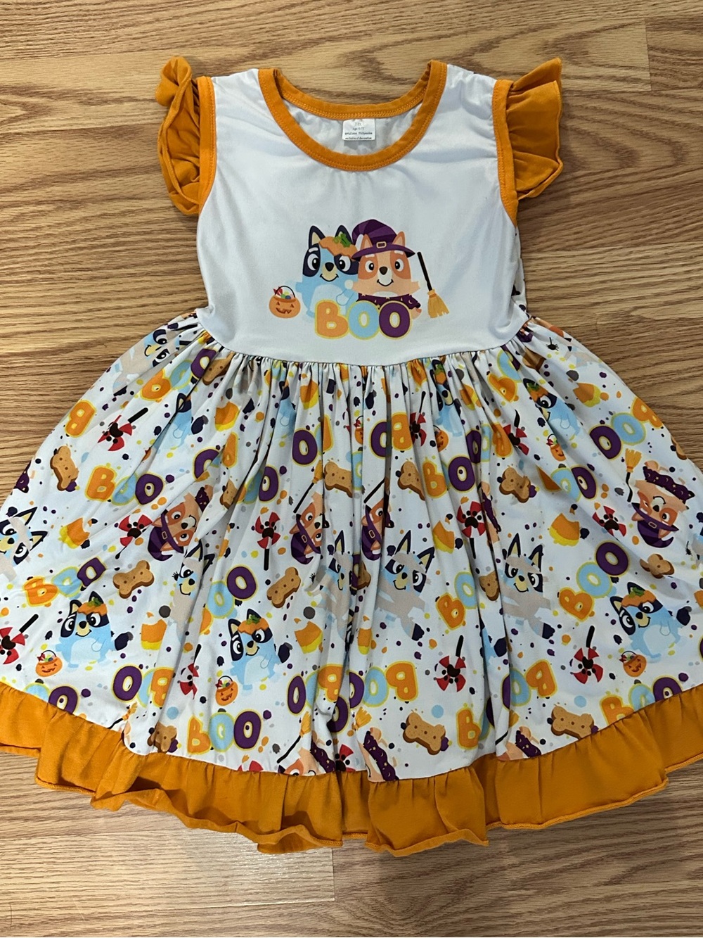 Girls Halloween 'Boo' Ruffle Dress in Orange and White